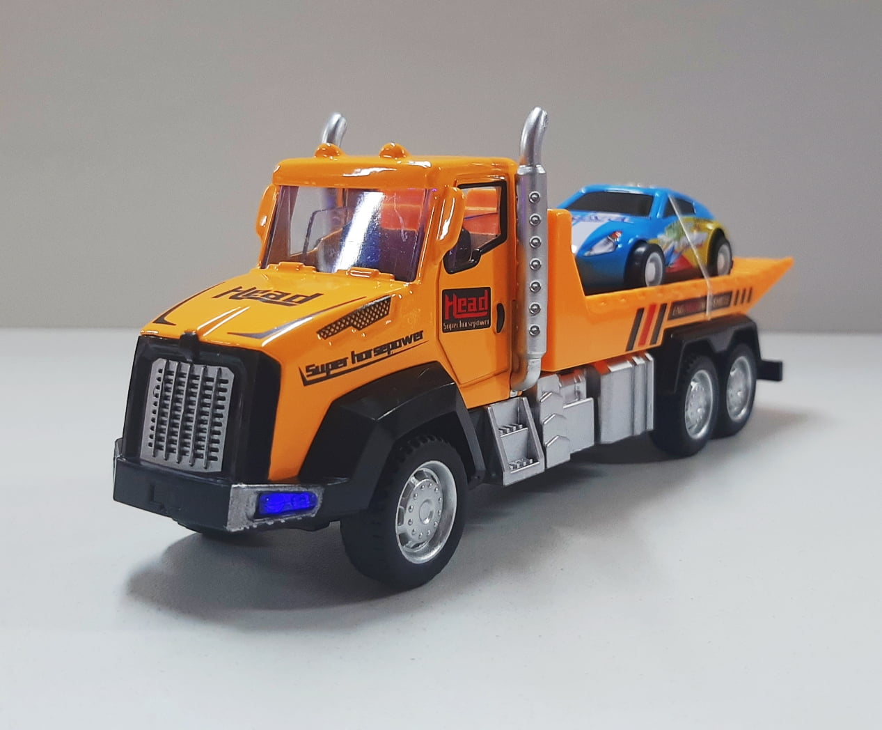 Miniatura Brinquedo Som e Luzes Caminhão plataforma carro azul 17cm